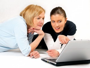 Mother and Daughter Using Laptop