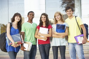 Group Of Teenage Students Standing Outside College Building